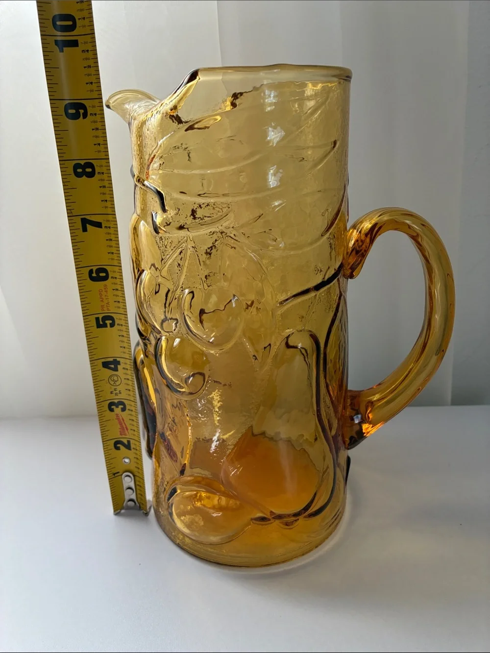 Amber Pressed Glass Pitcher with Fruit Motif